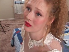 sGirls presents: Redhead in wedding dress models her pussy