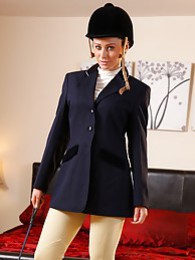 sGirls presents: Clare R seductifvely removes her riding gear leaving on only opaque hold ups and sheer underwear